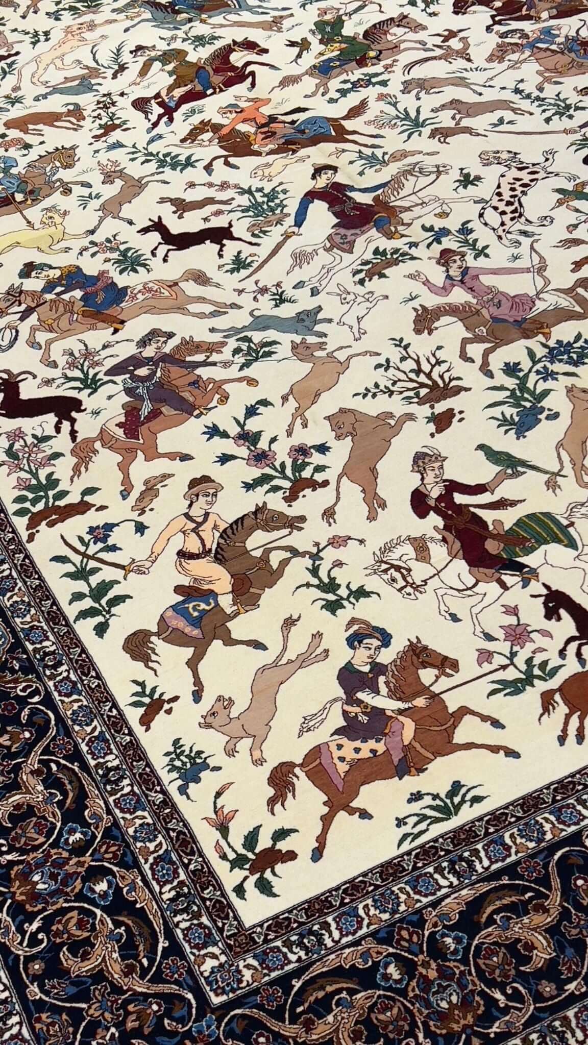 "Luxurious wool and silk Isfahan rug showcasing a traditional hunting scene."